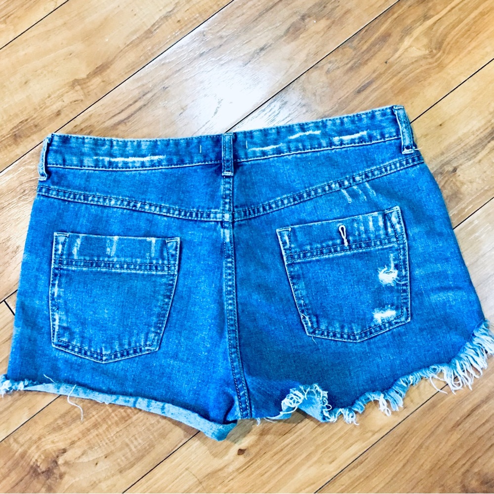 Free People denim blue jean shorts distressed cut off style 32” waist